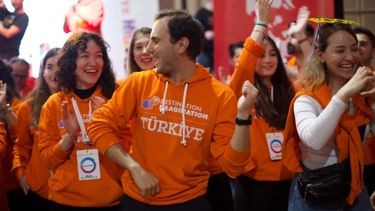 Volunteers from Destination Imagination Turkey celebrate at their tournament.