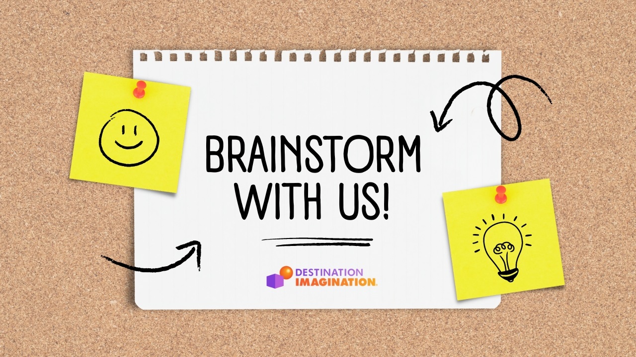 Bulletin board with a paper note that says, "Brainstorm with us!"