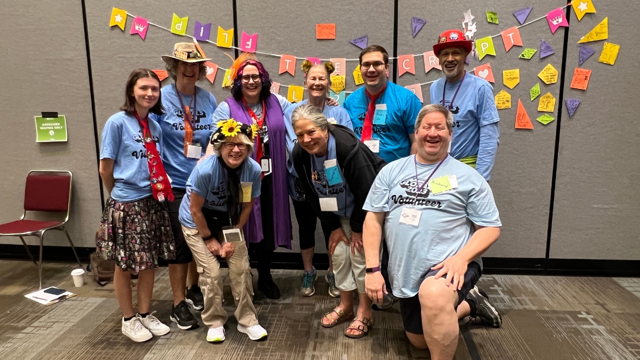 Global Finals 2023 volunteer Appraisers smiling at posing for a photo.