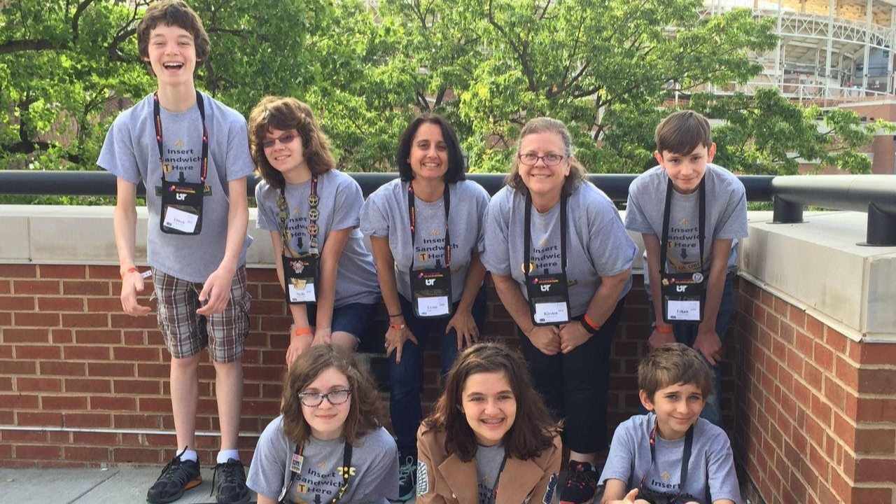 A Destination Imagination team poses for a photo at Global Finals.