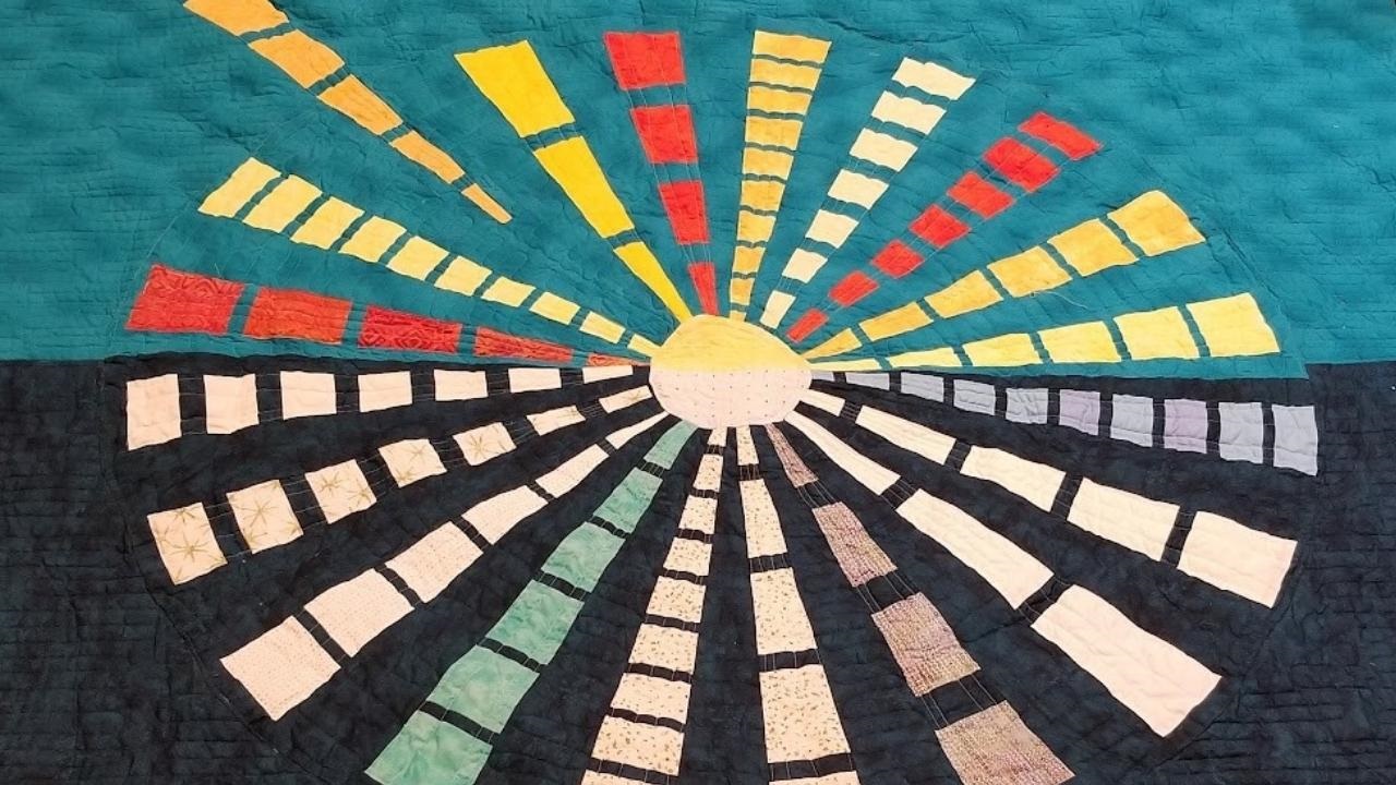 Photo of a quilt made by DI's Executive Director, Michele Tuck-Ponder