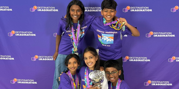 DI team, We Die For DI, wearing matching purple DI shirts and holding their trophy at Global Finals 2025. 