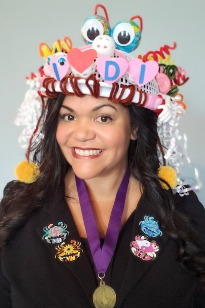 Michelle Talkington is wearing a DI hat she created for the Hats On For Creativity fundraising challenge. 