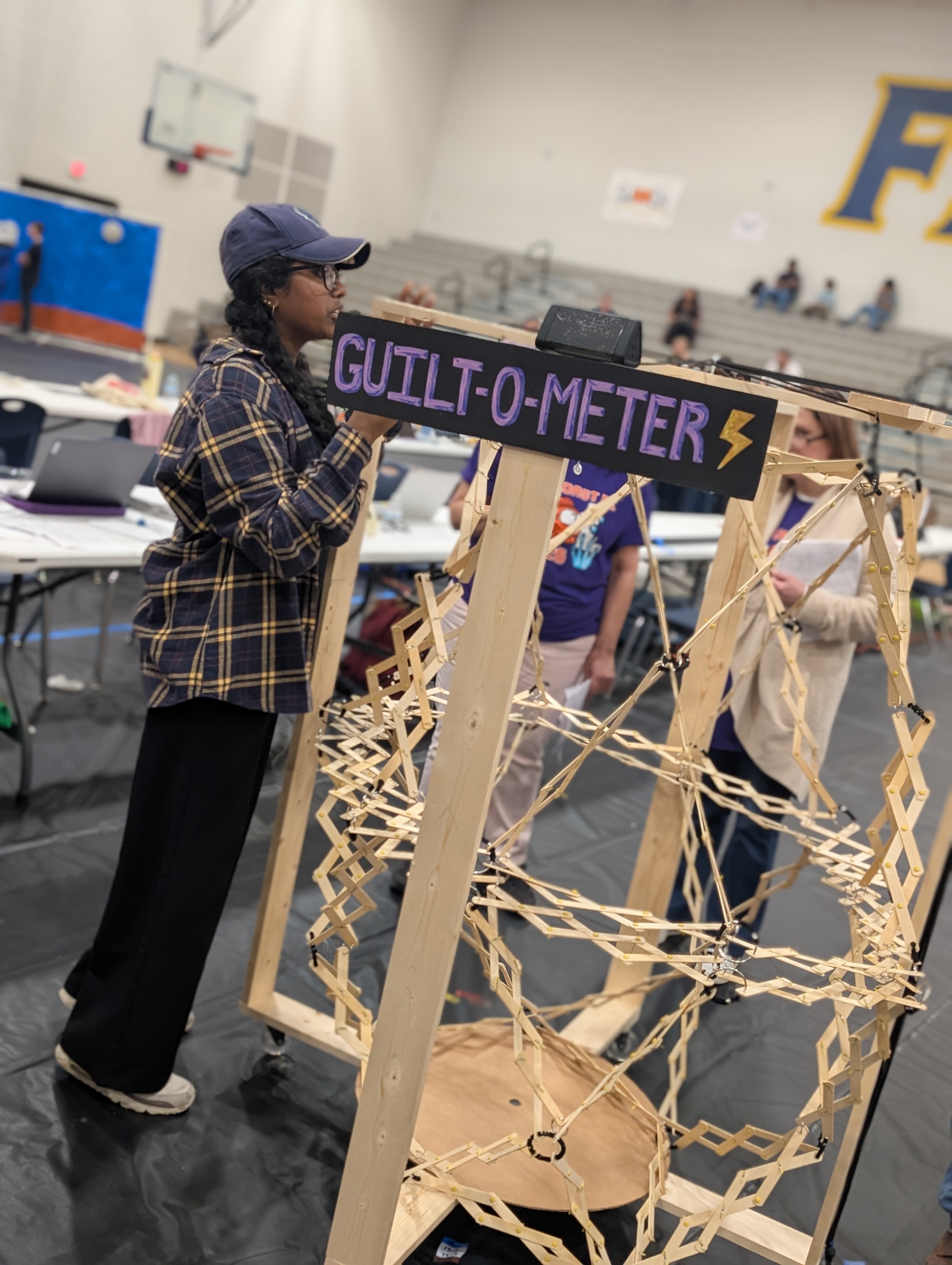 Students test an engineering solution during a Destination Imagination tournament.